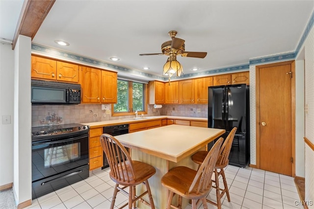 112 Elmcrest Cir, Salina, NY 13090 - kitchen featuring black appliances, light tile patterned floors, ceiling fan, light countertops, and recessed lighting