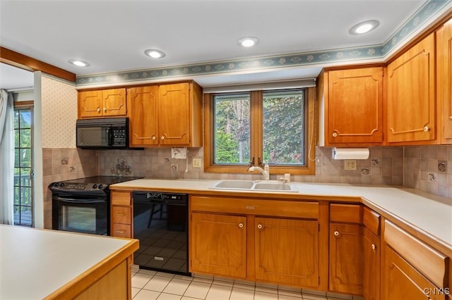 112 Elmcrest Cir, Salina, NY 13090 - kitchen with black appliances, a sink, light countertops, and brown cabinets