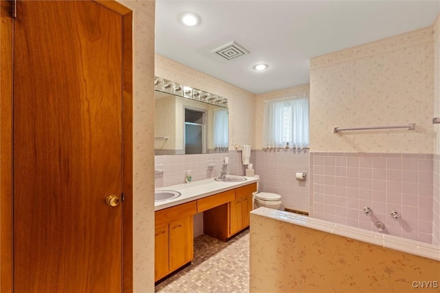 112 Elmcrest Cir, Salina, NY 13090 - full bath with double vanity, tile walls, toilet, a tub, and a shower