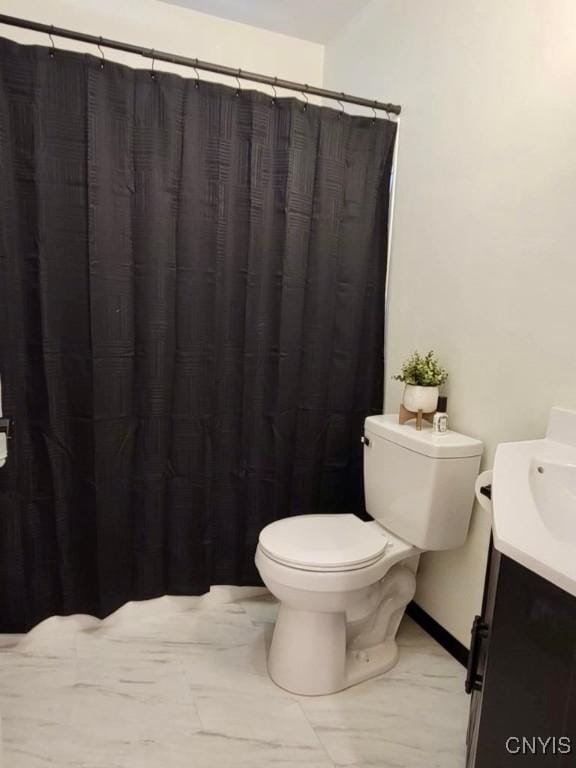 706 Dawes Ave, Utica, NY 13502 - bathroom featuring vanity, toilet, baseboards, and curtained shower