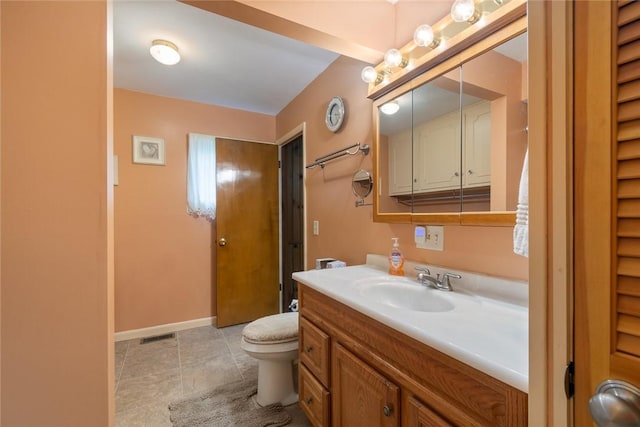 141 W Pearl St, Arcadia, NY 14513 - bathroom with vanity, toilet, baseboards, and a closet