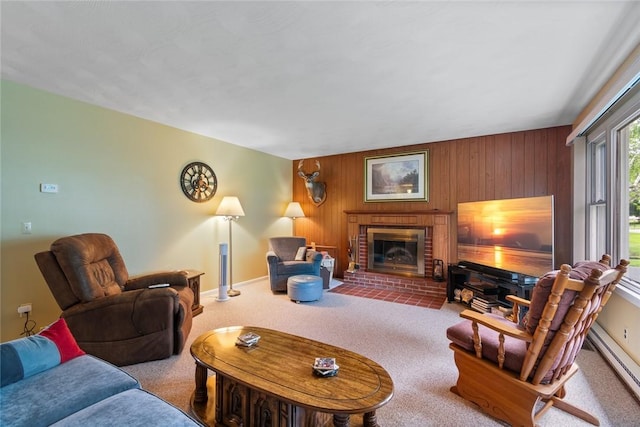 141 W Pearl St, Arcadia, NY 14513 - living area featuring a baseboard heating unit, carpet, a brick fireplace, wood walls, and baseboards