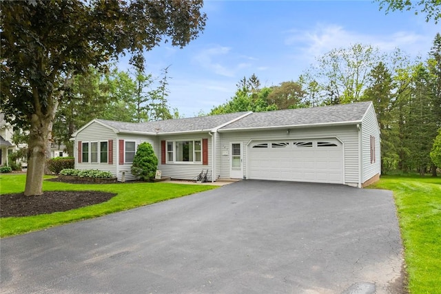141 W Pearl St, Arcadia, NY 14513 - ranch-style house with a garage, asphalt driveway, a front yard, and a shingled roof