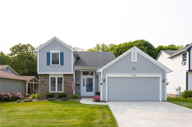 281 Burley Rd, Rochester, NY 14612 - split level home featuring driveway, an attached garage, a front lawn, and brick siding