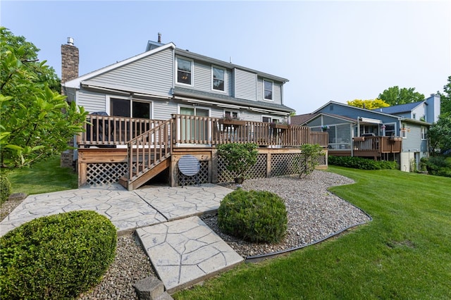 281 Burley Rd, Rochester, NY 14612 - rear view of house with a patio, a wooden deck, a yard, and a chimney