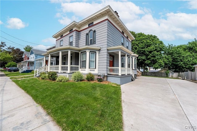 55 E 5th St, Oswego-City, NY 13126 - italianate home featuring covered porch and concrete driveway