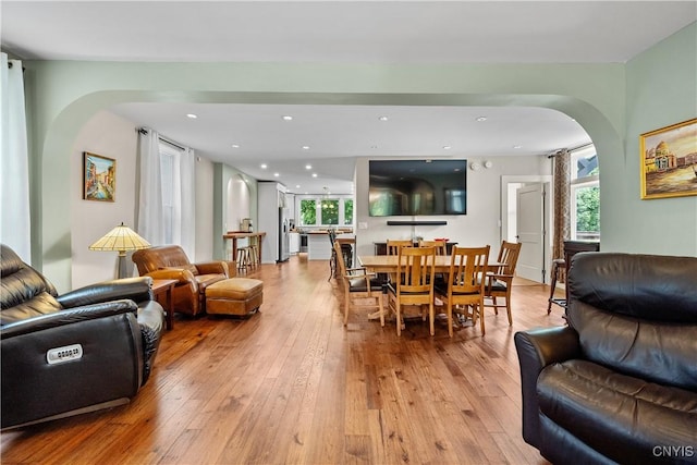55 E 5th St, Oswego-City, NY 13126 - living room with arched walkways, healthy amount of natural light, light wood-style floors, and recessed lighting