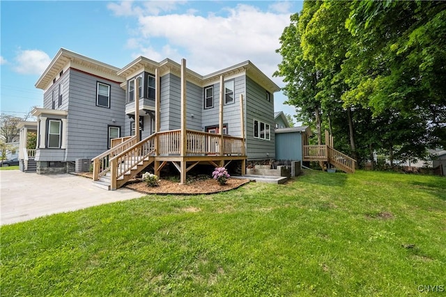 55 E 5th St, Oswego-City, NY 13126 - rear view of house with stairway, a deck, and a lawn
