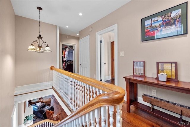 55 E 5th St, Oswego-City, NY 13126 - hall with wood finished floors, recessed lighting, baseboards, and a chandelier