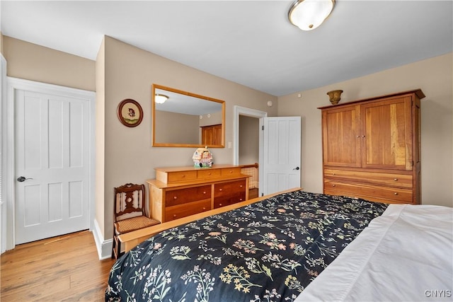 55 E 5th St, Oswego-City, NY 13126 - bedroom featuring wood finished floors and baseboards