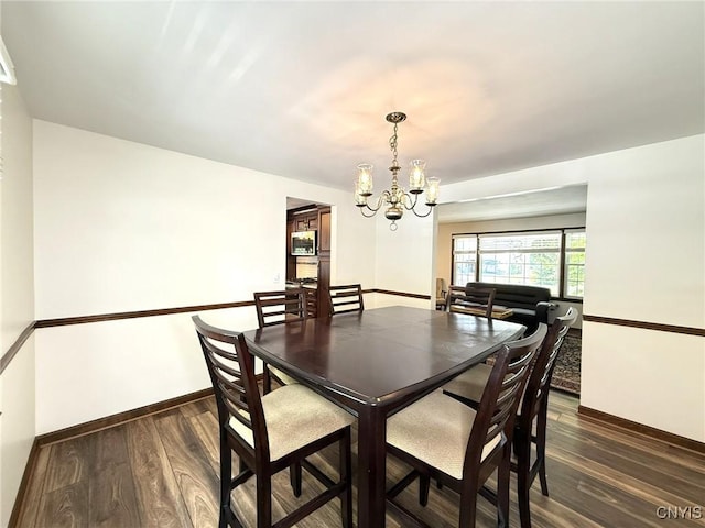 4936 Look Kinney Cir, Clay, NY 13088 - dining area with a chandelier, baseboards, and dark wood-type flooring