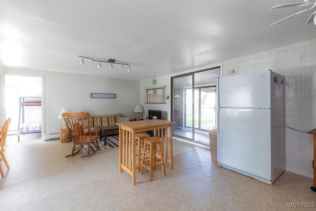 17 Porter Center Rd Unit N, Porter, NY 14174 - dining space with a ceiling fan, a baseboard radiator, and light floors