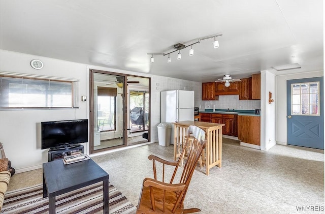 17 Porter Center Rd Unit N, Porter, NY 14174 - living room with ceiling fan, healthy amount of natural light, and baseboards