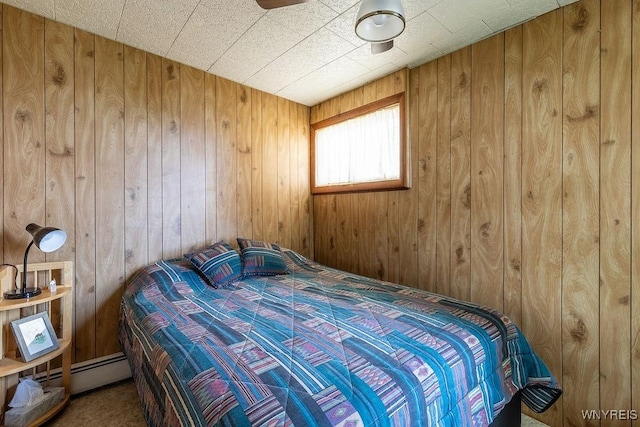 17 Porter Center Rd Unit N, Porter, NY 14174 - bedroom with wooden walls and a baseboard radiator