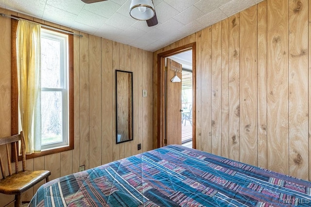17 Porter Center Rd Unit N, Porter, NY 14174 - bedroom featuring wooden walls and ceiling fan