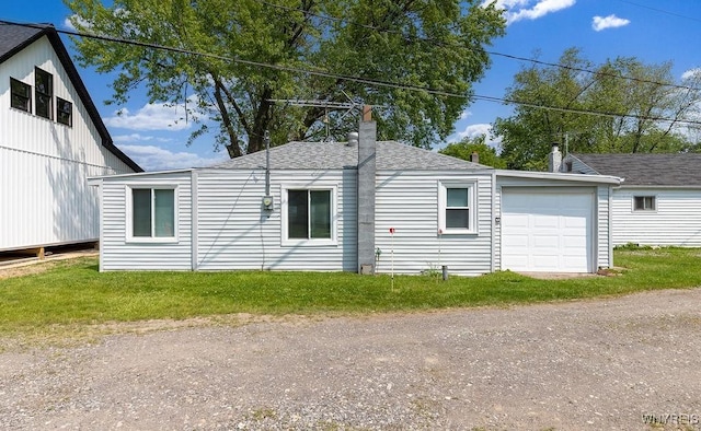 17 Porter Center Rd Unit N, Porter, NY 14174 - view of side of property with dirt driveway, a chimney, a shingled roof, and a garage