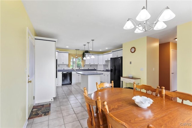 2220 W Genesee Tpke, Camillus, NY 13031 - dining space featuring a chandelier, light tile patterned floors, and baseboards