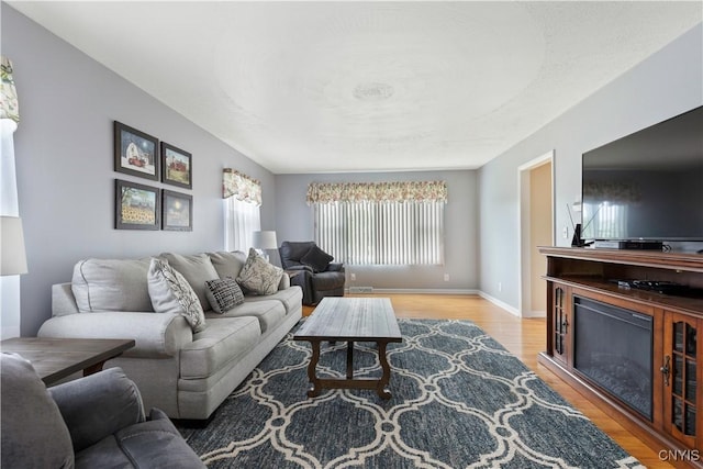 2220 W Genesee Tpke, Camillus, NY 13031 - living area featuring wood finished floors and baseboards