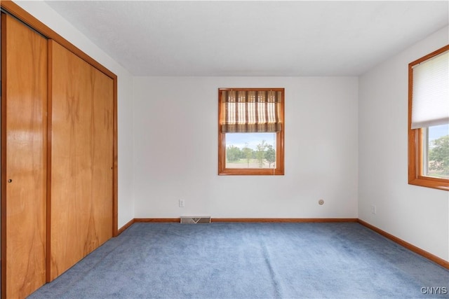 2220 W Genesee Tpke, Camillus, NY 13031 - unfurnished bedroom with carpet, a closet, and baseboards