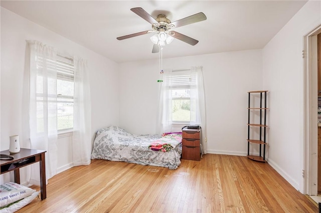 12 Queensboro Rd, Irondequoit, NY 14609 - bedroom featuring light wood-type flooring, baseboards, and a ceiling fan
