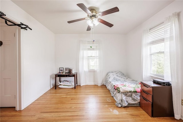 12 Queensboro Rd, Irondequoit, NY 14609 - bedroom with light wood-type flooring, ceiling fan, and baseboards
