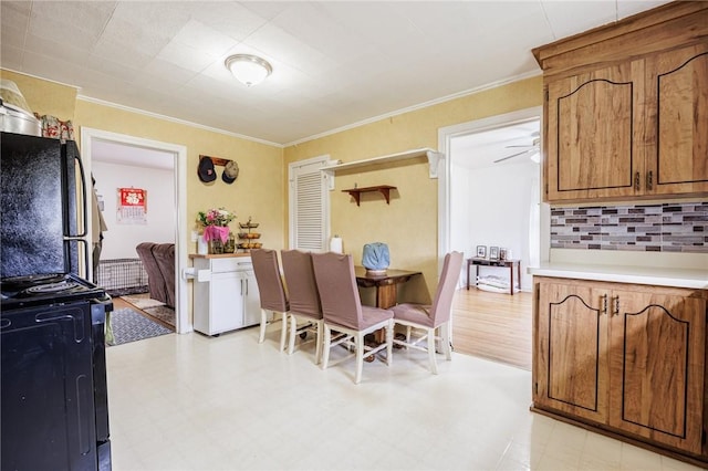 12 Queensboro Rd, Irondequoit, NY 14609 - dining room featuring light floors and ornamental molding