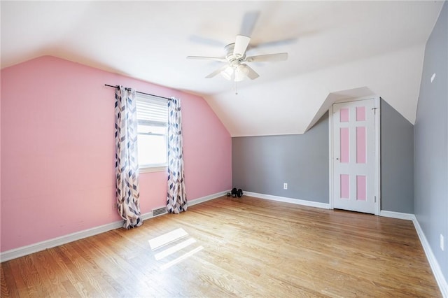12 Queensboro Rd, Irondequoit, NY 14609 - bonus room with vaulted ceiling, a ceiling fan, wood finished floors, and baseboards
