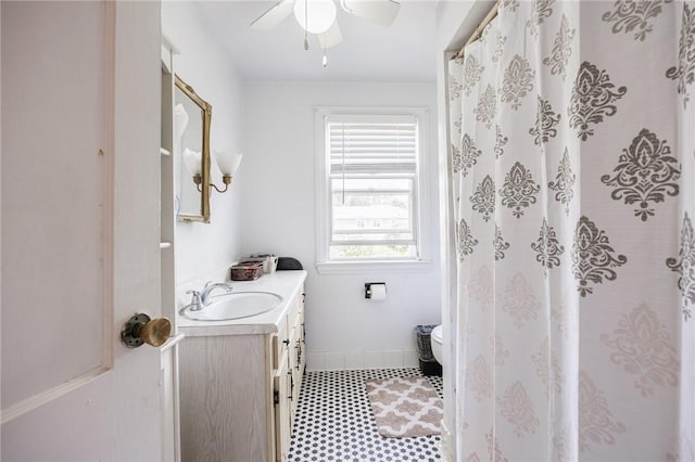 12 Queensboro Rd, Irondequoit, NY 14609 - bathroom featuring vanity, a ceiling fan, toilet, tile patterned floors, and a shower with shower curtain