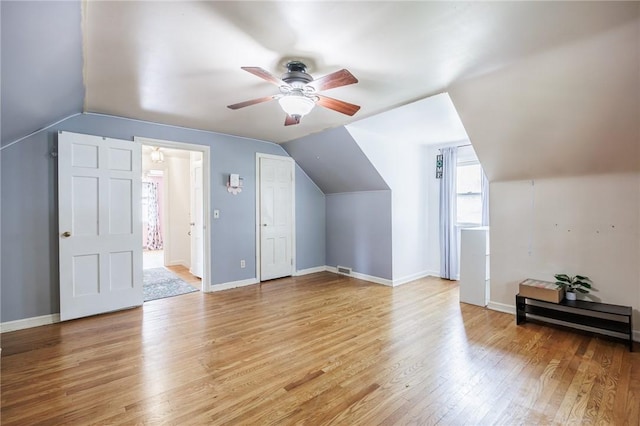 12 Queensboro Rd, Irondequoit, NY 14609 - additional living space featuring ceiling fan, light wood finished floors, lofted ceiling, and baseboards
