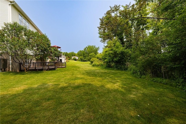 74 Broadmoor Trl, Perinton, NY 14450 - view of grassy yard featuring a deck
