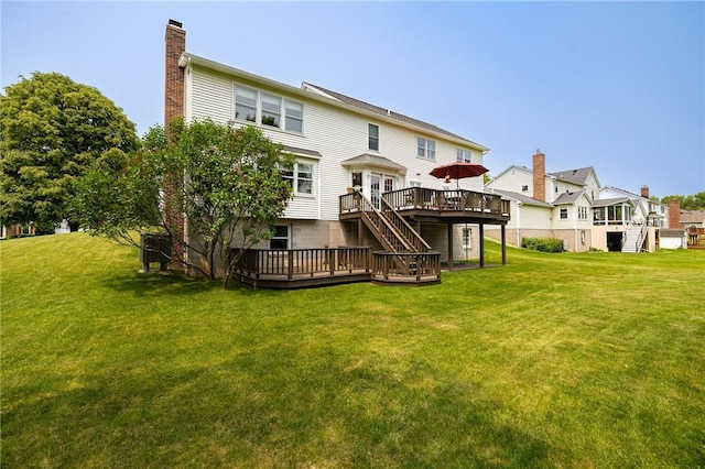 74 Broadmoor Trl, Perinton, NY 14450 - rear view of house with stairway, a wooden deck, a chimney, and a yard