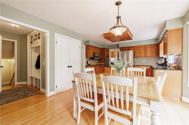 74 Broadmoor Trl, Perinton, NY 14450 - dining area featuring light wood finished floors and baseboards
