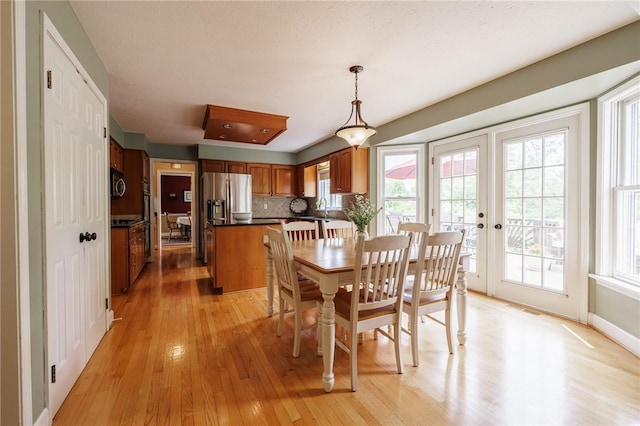 74 Broadmoor Trl, Perinton, NY 14450 - dining room with light wood-style floors, french doors, and baseboards