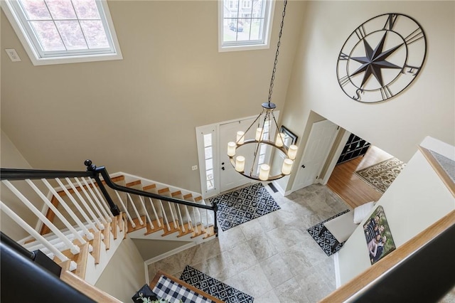 74 Broadmoor Trl, Perinton, NY 14450 - entrance foyer with healthy amount of natural light, stairway, and a towering ceiling