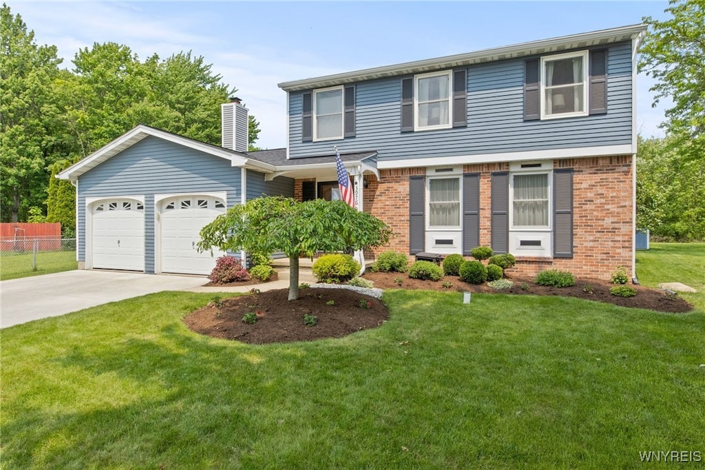 3976 Summerway Ln, Hamburg, NY 14075 - view of front of house with brick siding, driveway, a garage, and a chimney