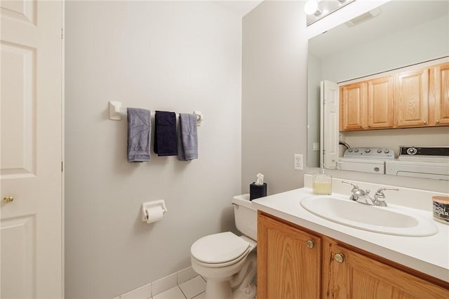 3 Legacy Oak Trl, Henrietta, NY 14534 - half bath with washing machine and clothes dryer, tile patterned floors, vanity, and toilet