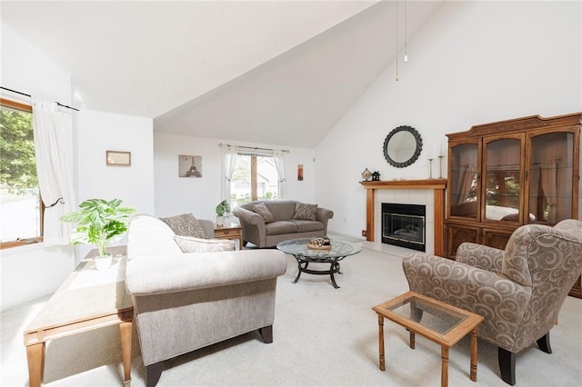 3 Legacy Oak Trl, Henrietta, NY 14534 - living area featuring light carpet, a tiled fireplace, and high vaulted ceiling