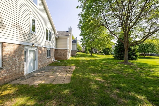 3 Legacy Oak Trl, Henrietta, NY 14534 - view of grassy yard featuring a patio area