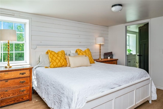2309 Mcburney Rd, Phelps, NY 14432 - bedroom featuring light wood finished floors and ensuite bath