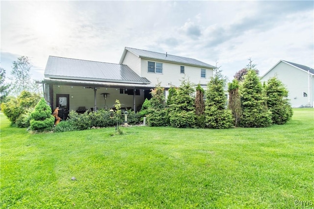 1 Carol Dr, Adams, NY 13605 - back of property with a yard and a metal roof