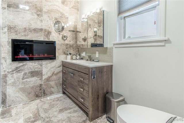 1 Carol Dr, Adams, NY 13605 - bathroom featuring vanity and decorative backsplash