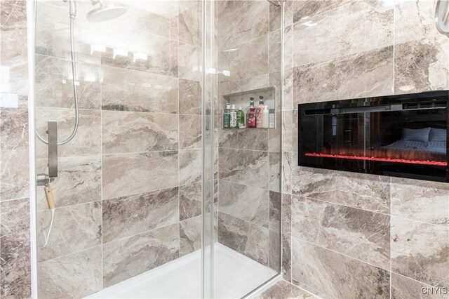 1 Carol Dr, Adams, NY 13605 - bathroom featuring a stall shower and a glass covered fireplace