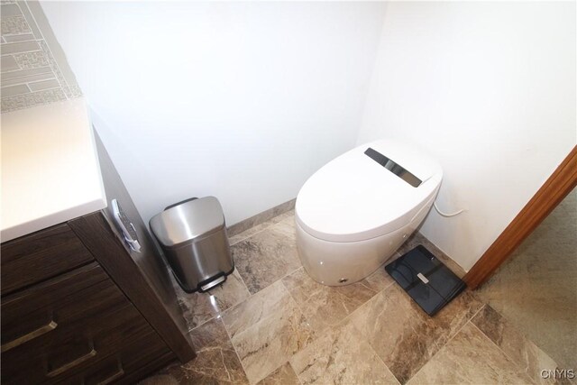1 Carol Dr, Adams, NY 13605 - bathroom with baseboards and stone finish floors
