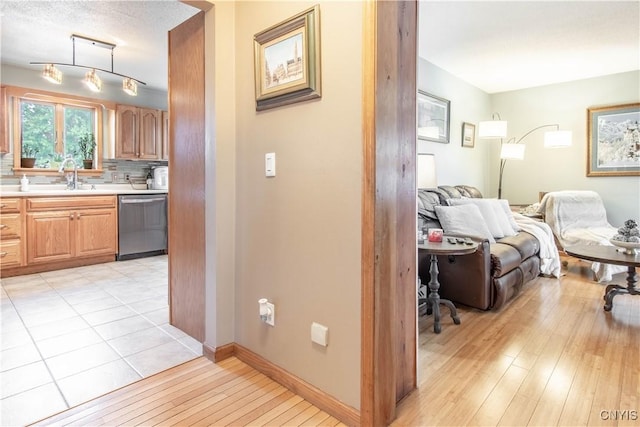 1 Carol Dr, Adams, NY 13605 - corridor featuring light wood-style flooring and a sink