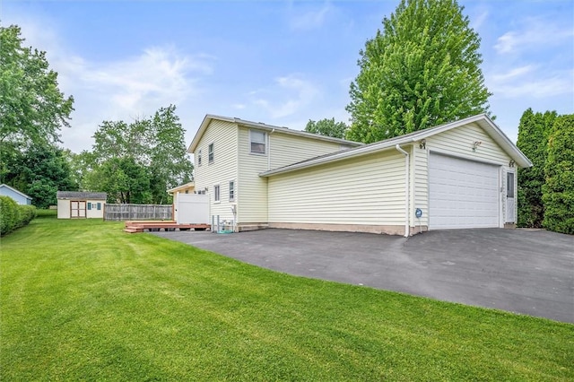 75 Red Rock Cir, Greece, NY 14626 - view of side of property featuring a yard, a deck, and driveway