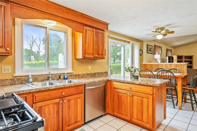 75 Red Rock Cir, Greece, NY 14626 - kitchen with dishwasher, a sink, gas range oven, a peninsula, and plenty of natural light