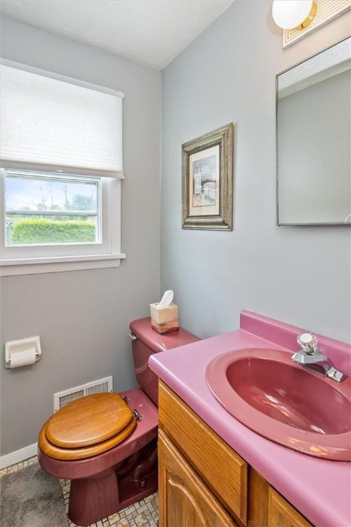 75 Red Rock Cir, Greece, NY 14626 - bathroom featuring vanity and toilet