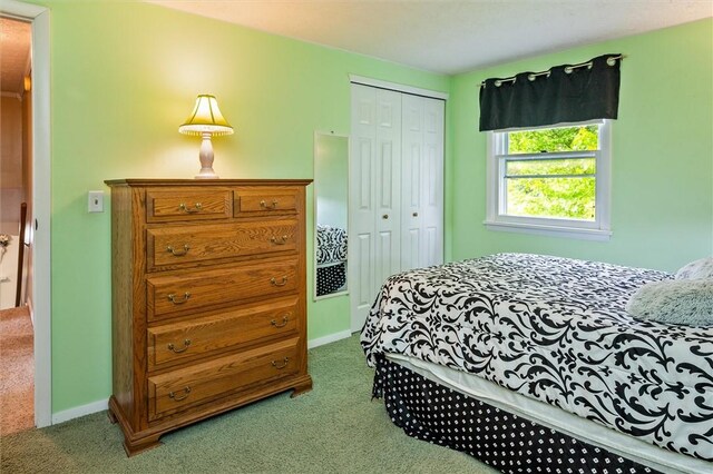 75 Red Rock Cir, Greece, NY 14626 - carpeted bedroom featuring a closet and baseboards