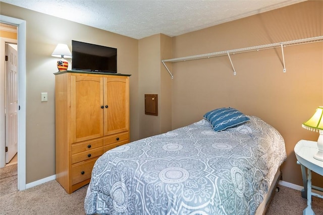 75 Red Rock Cir, Greece, NY 14626 - bedroom with light colored carpet, baseboards, and a textured ceiling