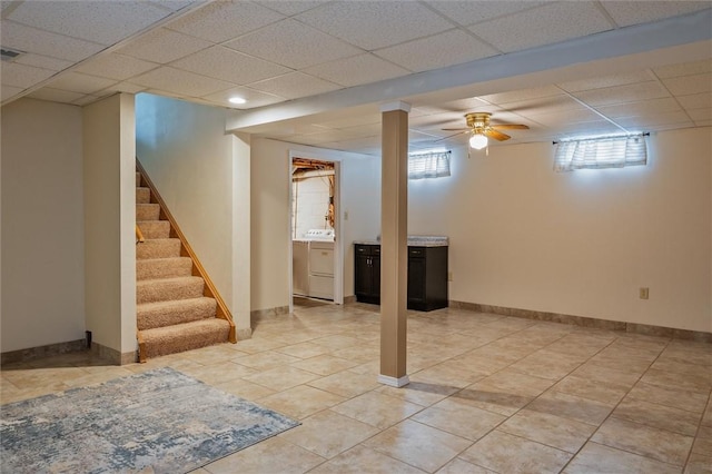 75 Red Rock Cir, Greece, NY 14626 - basement featuring a paneled ceiling, stairs, light tile patterned flooring, recessed lighting, and baseboards